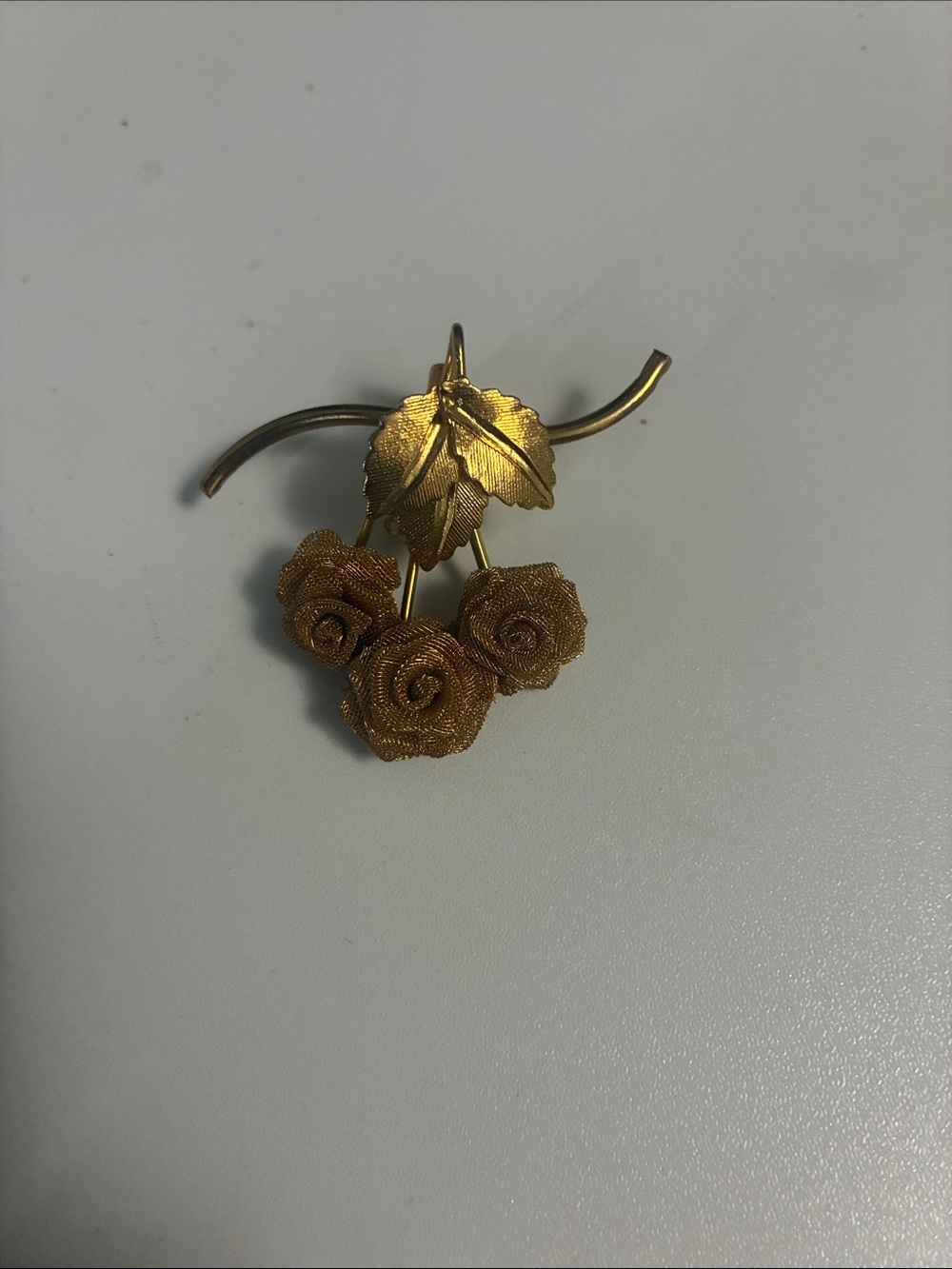 Vintage gold toned rose pin brooch